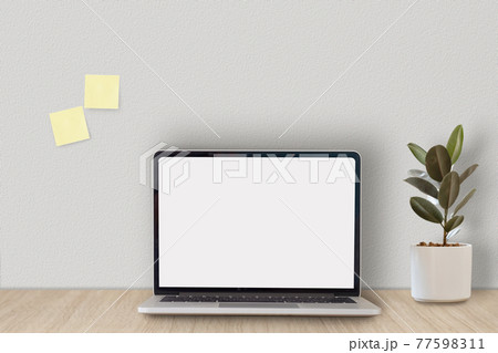 Cropped shot of minimal workspace with mock-up laptop, plant, decorations and copy space. Cropped shot of minimal workspace with mock-up laptop, plant, decorations and copy space. 77598311