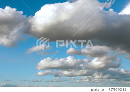 peace blue sky with big fluffy clouds 77599211