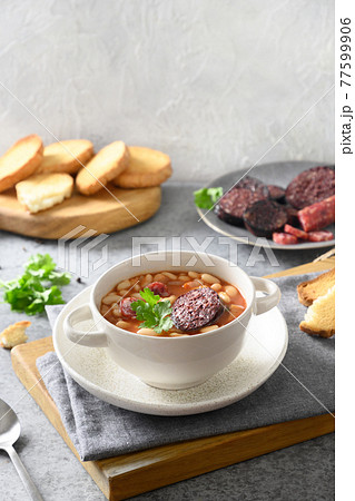 Spanish fabada on gray table. Copy space 77599906