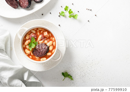 Spanish asturiana fabada on white table. Copy space 77599910