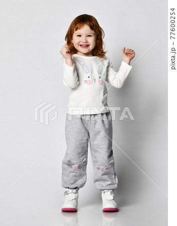 little red-haired girl emotionally exclaiming and 77600254