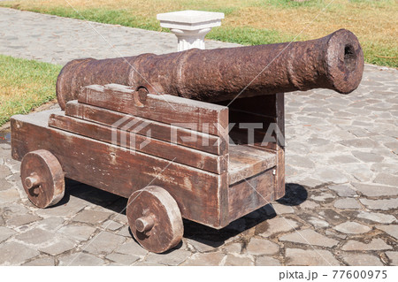 Ancient ship cannon, close-up photo 77600975