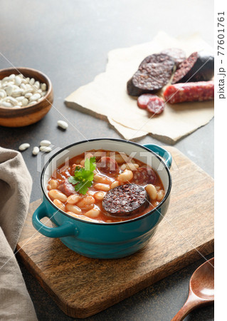 Spanish fabada on brown table. Copy space Spanish fabada on brown table. Copy space 77601761