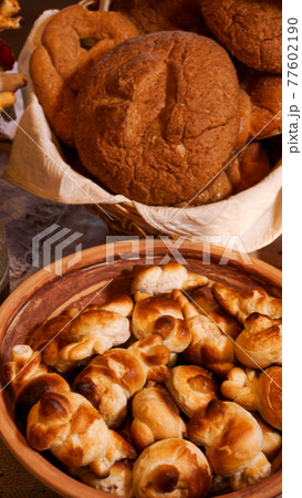 Homemade fresh sweet dough bagels in a basket. Rustic style Homemade fresh sweet dough bagels in a basket. Rustic style 77602190