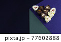 chocolate assortment candies isolated on geometric box 77602888