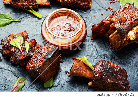 Roasted sliced barbecue beef ribs Roasted sliced barbecue beef ribs 77603725