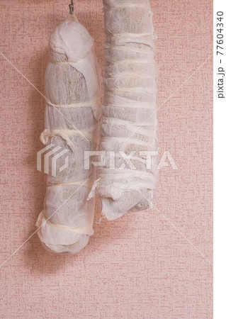 Pork loin, polendwitz wrapped in gauze and hung for drying 77604340