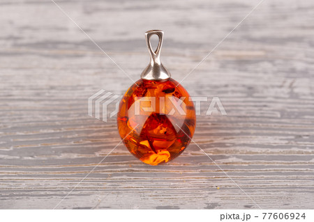 Pendant in the form of a large drop of natural amber of bright cognac color Pendant in the form of a large drop of natural amber of bright cognac color 77606924