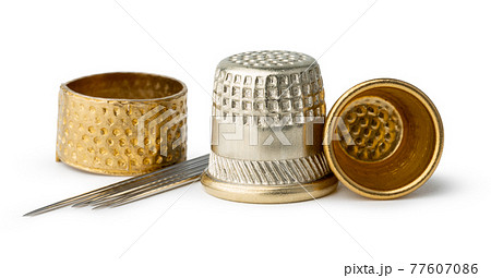 Metal sewing thimble isolated on white 77607086