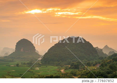 Guilin, China Karst Mountain landscape at Dusk Guilin, China Karst Mountain landscape at Dusk 77607852