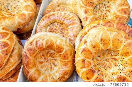 Fresh flat breads with sesame seeds from the tandir 77609756