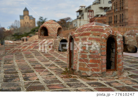 Popular city landmark in Tbilisi. Ancient underground complex of sulfur baths Popular city landmark in Tbilisi. Ancient underground complex of sulfur baths 77610247
