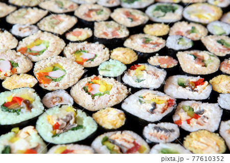 Sushi Set - Different Types of Maki Sushi and Nigiri Sushi. Served on dark wooden table. 77610352