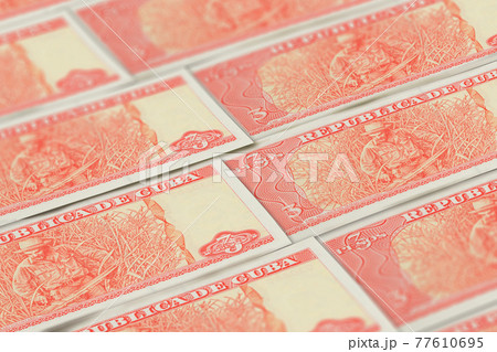 CUP. Cuban peso banknotes background. Cuban currency. 77610695
