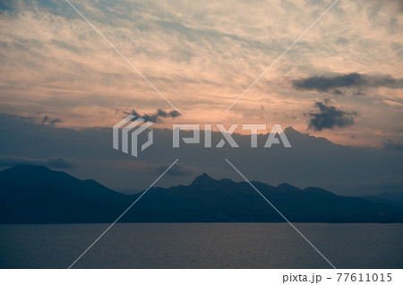 Beautiful natural landscape with mountains, sea and cloudy sky Beautiful natural landscape with mountains, sea and cloudy sky 77611015