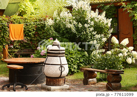 beautiful formal garden with dining place, table tandoor bench beautiful formal garden with dining place, table tandoor bench 77611099