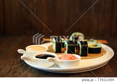 hot roll set sashimi japanese food on wooden background 77611304