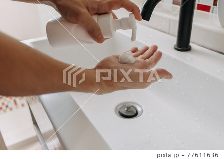 Washing hands with foam in the toilet. Concept of cleaning and protection. Washing hands with foam in the toilet. Concept of cleaning and protection. 77611636