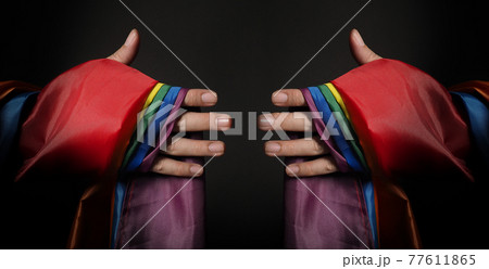 LGBTQ pride flag. Lesbian Gay Bi sexsual Transgender Queer. Homosexsual pride Rainbow flag in gay hand. black background. Represent symbol of freedom, peace, equality and love. LGBTQ concept. 77611865