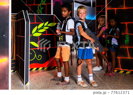 Preteen boys posing with laser guns Preteen boys posing with laser guns 77612371