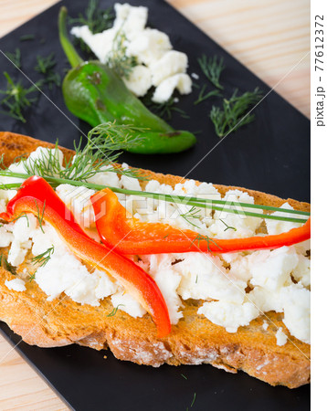 Canape with young cheese and pepper Canape with young cheese and pepper 77612372