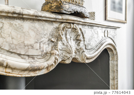 Marble ornament of aged original fireplace 77614043