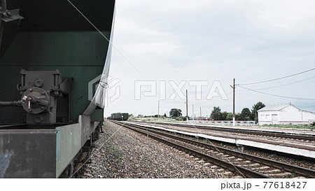 Boxcars in the railway station, railway tracks 77618427