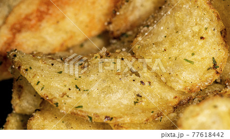 Natural fat potato chips with salt, black pepper, herbs and vegetable oil 77618442