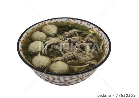 Beef clear soup with sliced beef, meatball and vegetables in bowl isolated on white background with clipping path. 77620255