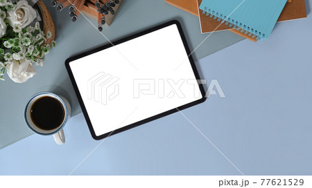 Flay lay, Top view office desk with digital tablet, coffee cup, notebook and pencil holder. 77621529