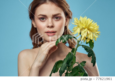 girl with flowers cropped view portrait close-up spring bare shoulders clear skin Make Up girl with flowers cropped view portrait close-up spring bare shoulders clear skin Make Up 77621961