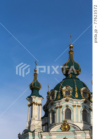 Green domes of the Kiev-Pechersk Lavra church against the blue sky Green domes of the Kiev-Pechersk Lavra church against the blue sky 77623572