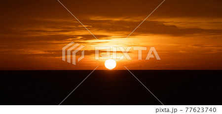 Sunset over the sea or Glowing sea sunrise. 77623740