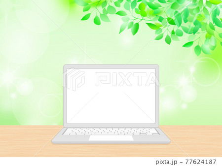 新緑背景と開いたシンプルなシルバー系ノートパソコン　グレー系白キー 77624187