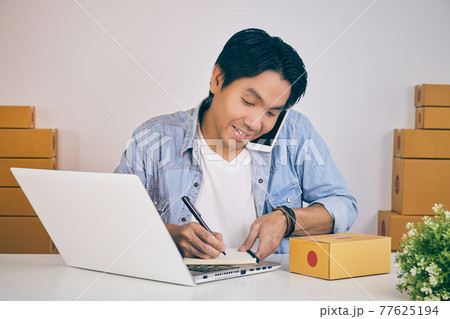 Smile Online Merchant Talk with Customer Via Smartphone and Write Notebook in Vintage Tone 77625194