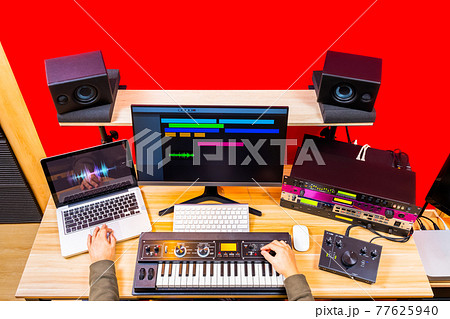 top view of professional music producer hands arranging a hit song in home recording studio. music production concept background top view of professional music producer hands arranging a hit song in home recording studio. music production concept background 77625940