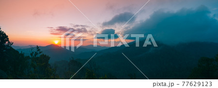 Panoramic mountain landscape. Majestic sunrise of the mountains layer in the morning. Serenity Panoramic mountain landscape. Majestic sunrise of the mountains layer in the morning. Serenity 77629123