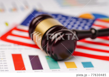 Gavel for judge lawyer and United States of America USA flag on chart graph paper Gavel for judge lawyer and United States of America USA flag on chart graph paper 77630485