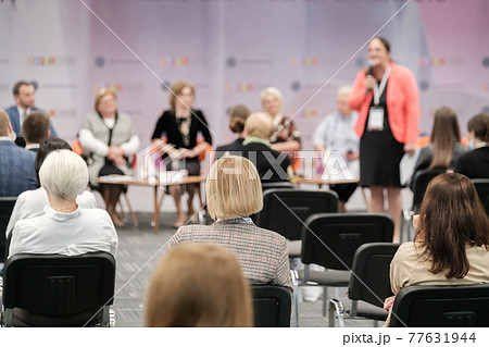 Business speaker doing presentation to audience Business speaker doing presentation to audience 77631944