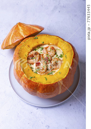Pumpkin stuffed with shrimps and cheese, whole baked. Traditional Brazilian dish. Close-up. Pumpkin stuffed with shrimps and cheese, whole baked. Traditional Brazilian dish. Close-up. 77633445