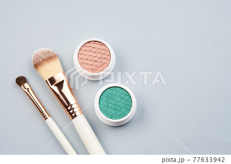 eyeshadow accessories beads makeup brushes collection professional cosmetics on gray background 77633942