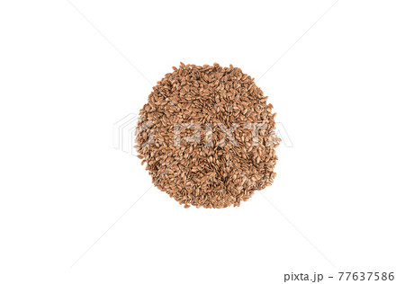 Heap of flax seeds isolated on white background. 77637586