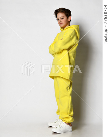 Full length portrait of a teenage boy dressed in a 77638754