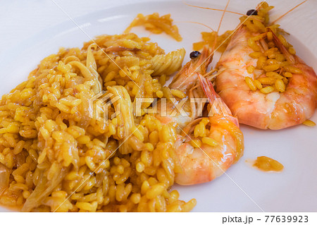 Close up of rice with onion and shrimps: selective focus: Homemade and traditional food concept. 77639923