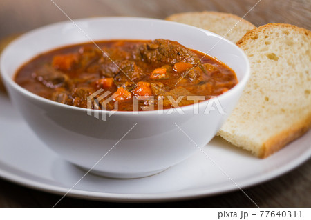 Hot Stew Bowl with Mushrooms. High quality photo. Hot Stew Bowl with Mushrooms. High quality photo. 77640311