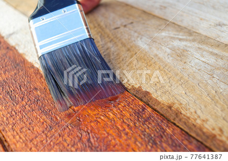 Wood Restoration Sealant Treatment Paintbrush Brushstroke Close-up Wood Restoration Sealant Treatment Paintbrush Brushstroke Close-up 77641387