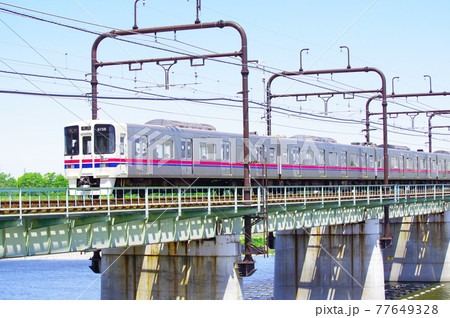 多摩川橋梁を通過する京王線 77649328