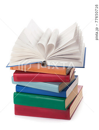 The book opens, and the book page rolls into the heart selective focus and with a very shallow depth of field The book opens, and the book page rolls into the heart selective focus and with a very shallow depth of field 77650716