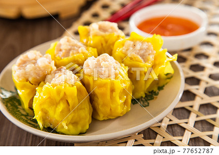 Siu Mai - Chinese steamed pork dumplings in bamboo steamers. Dim Sum 77652787