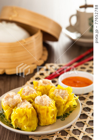 Siu Mai - Chinese steamed pork dumplings in bamboo steamers. Dim Sum 77652788